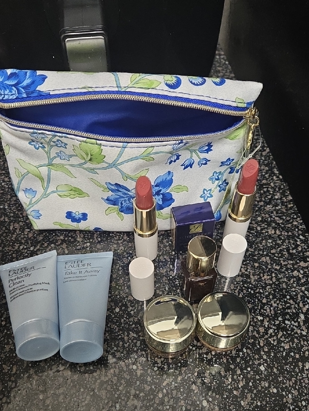 Estee Lauder Floral Blue & White Makeup Bag with Lipsticks and Skincare